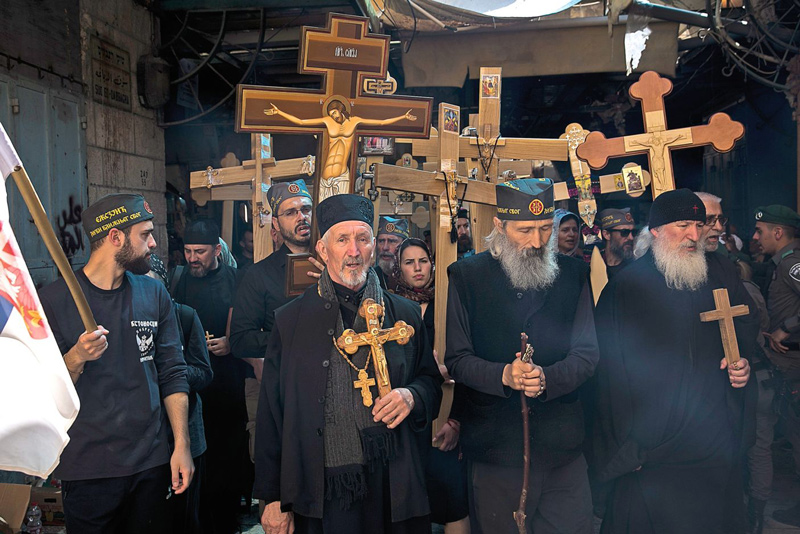Orthodox Christians walking on the Via Dolorosa, in Jerusalem’s Old City.