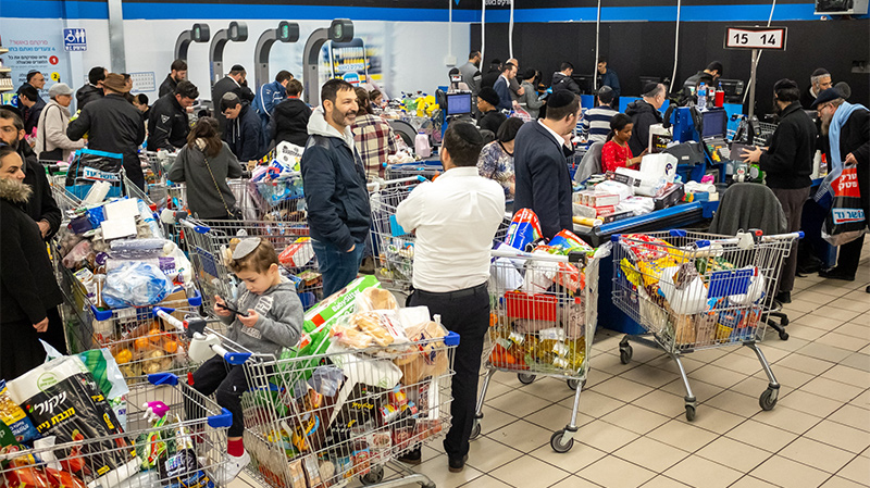 Israelis go shopping as they fear coronavirus might affect food supplies.