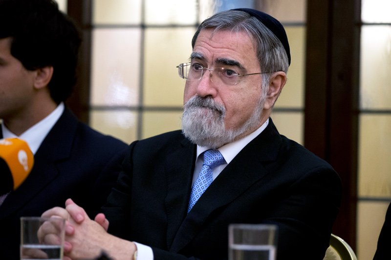 In this Nov. 17, 2014, file photo, Rabbi Lord Jonathan Sacks holds a press conference, at the Vatican. Sacks, the former chief rabbi in the U.K. who reached beyond the Jewish community with his regular broadcasts on radio, has died at 72. A statement on his Twitter page said he died early Saturday, Nov. 7, 2020.