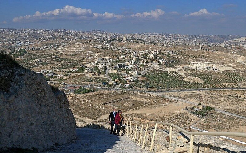 A couple climbs the steps leading to the ancient Herodium palace built by Herod the Great between 23-15 BCE in the Judaean desert, southeast of Bethlehem on November 24, 2020.